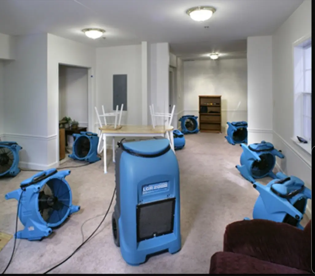 Air movers and dehumidifier setup for Water Damage Restoration in Ware